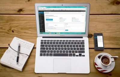 picture of an office desk with a laptop